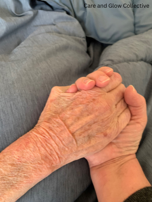 An adult hand gently holding the hand of an elderly loved one, symbolizing caregiving, comfort, and connection.